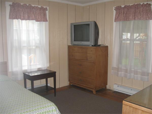 39 Griffin Street Springfield, MA 01104 - Photo 13 of 20 a bedroom with a bed and a mirror