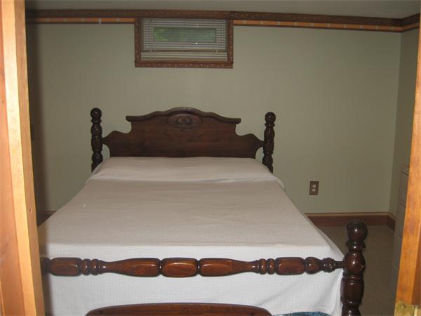 39 Griffin Street Springfield, MA 01104 - Photo 14 of 20 a bedroom with a bed and a painting on the wall