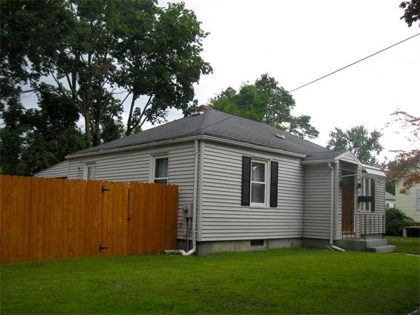 39 Griffin Street Springfield, MA 01104 - Photo 20 of 20 a view of backyard with potted plants and large tree