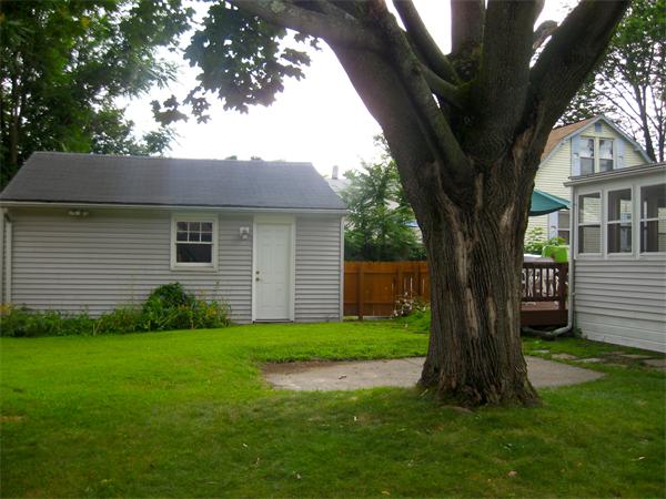 39 Griffin Street Springfield, MA 01104 - Photo 5 of 20 a view of a house with a tree in a yard