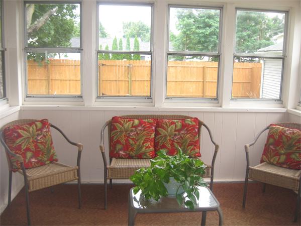 39 Griffin Street Springfield, MA 01104 - Photo 6 of 20 a bench sitting in a living room next to a window