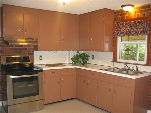 39 Griffin Street Springfield, MA 01104 - Photo 8 of 20 a kitchen with a sink stove and cabinets
