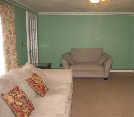 39 Griffin Street Springfield, MA 01104 - Photo 10 of 20 a bedroom with a bed and a couch