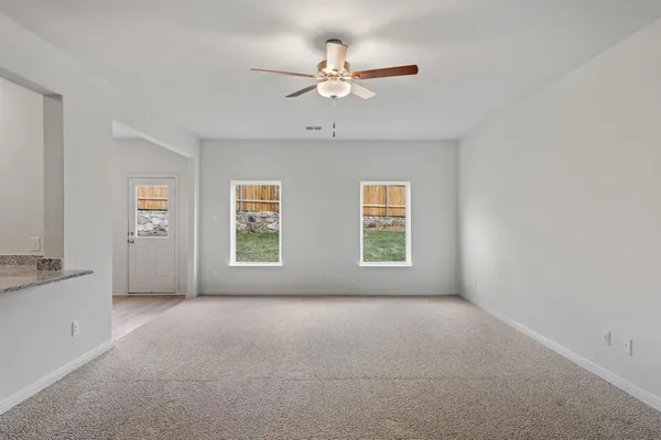 a view of an empty room with a window