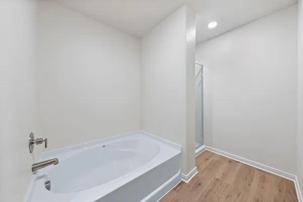 a bathroom with a tub and sink