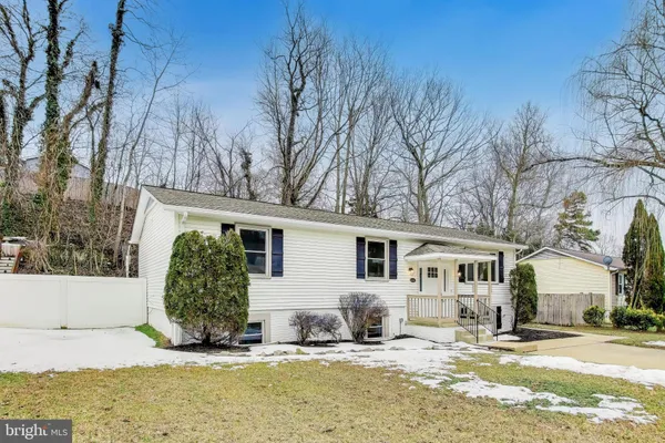 a view of a house with snow on the background
