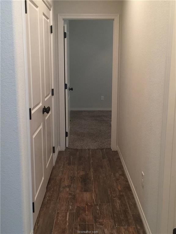 109 Ehlinger Drive Bryan, TX 77801 - Photo 5 of 25 a view of a bathroom from a hallway