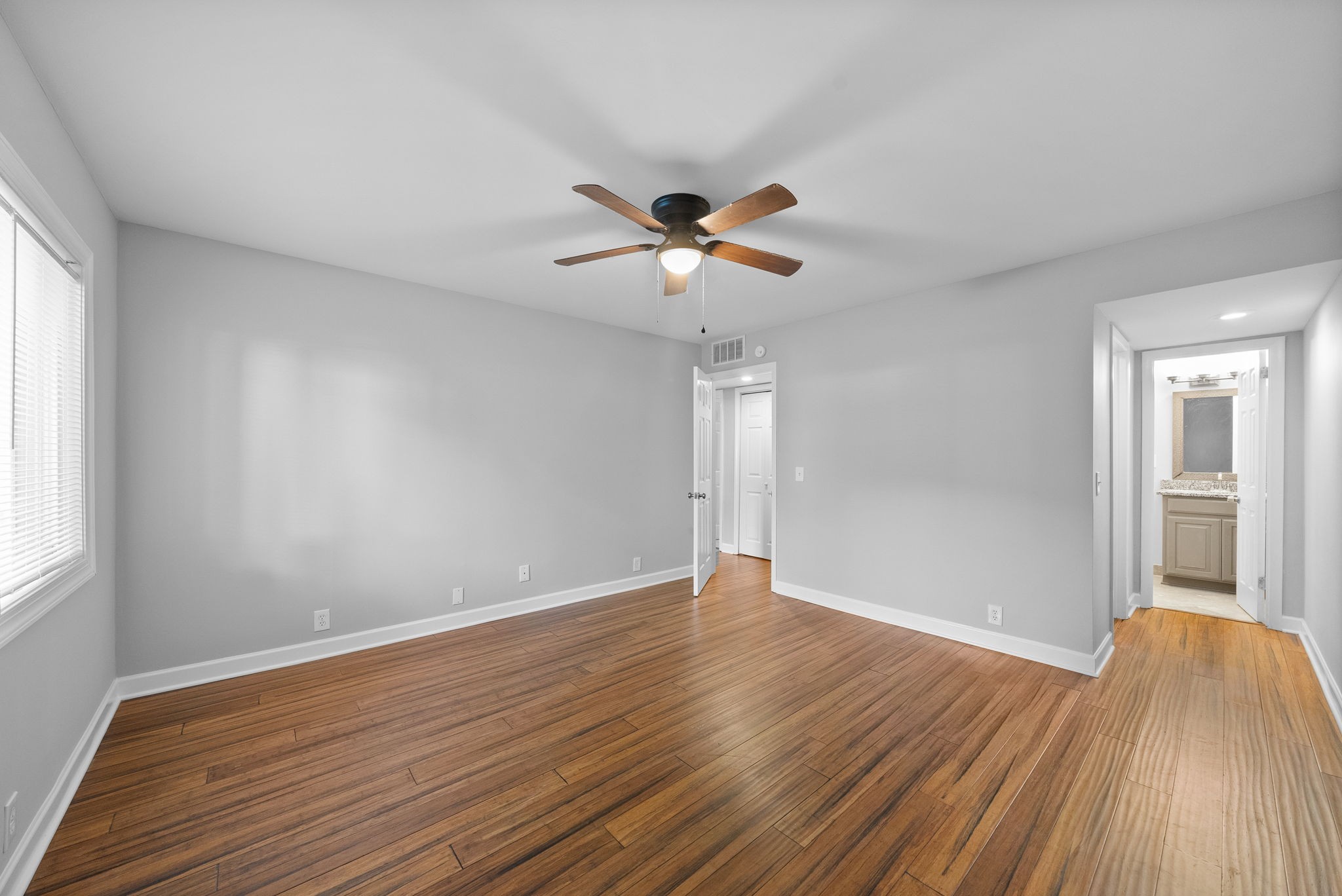 21 Vaughns Gap Road Nashville, TN 37205 - Photo 13 of 27 a view of a room with wooden floor and a ceiling fan
