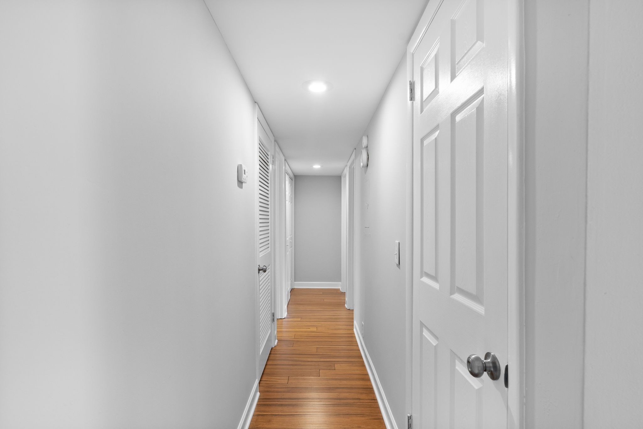 21 Vaughns Gap Road Nashville, TN 37205 - Photo 19 of 27 a view of a hallway with wooden floor and staircase