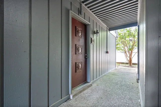 a kitchen with granite countertop a sink stainless steel appliances and cabinets