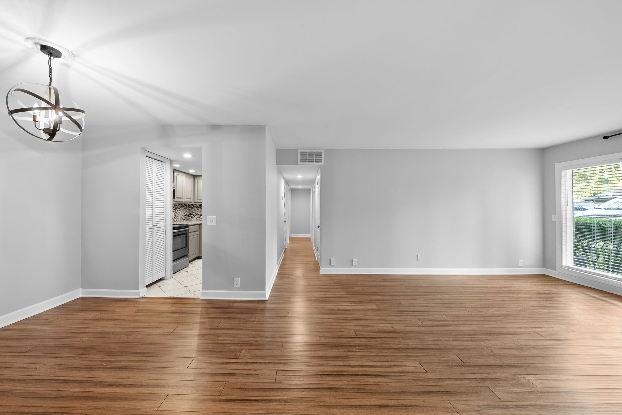 21 Vaughns Gap Road Nashville, TN 37205 - Photo 5 of 27 a view of empty room with wooden floor and window