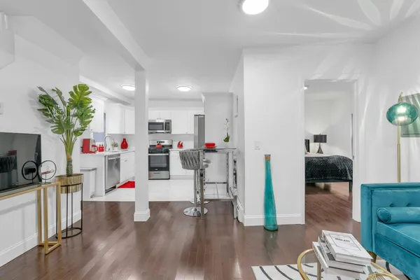 a kitchen with cabinets appliances and a window