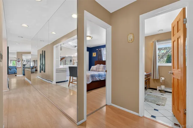 a spacious bedroom with a bed and a couch