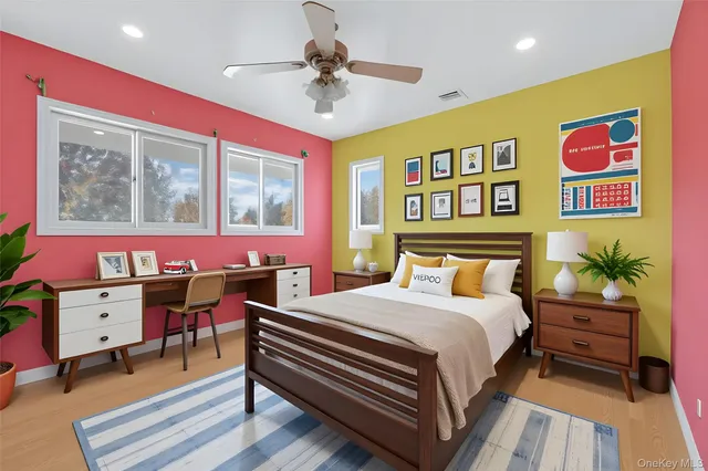 a view of a dinning tables and chairs in the patio in front of a building