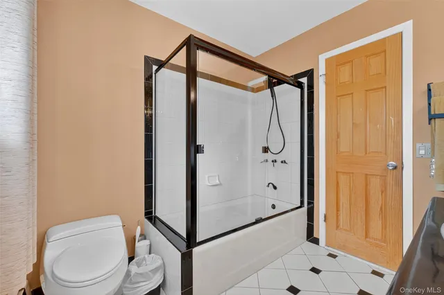 a view of a tennis ground with large trees