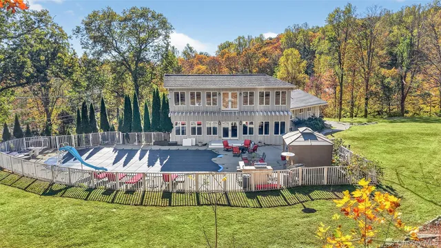 a living room with fireplace furniture and a flat screen tv