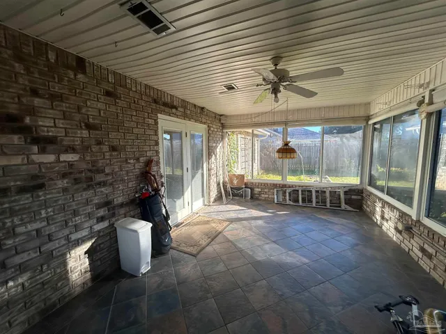 a view of a room with windows
