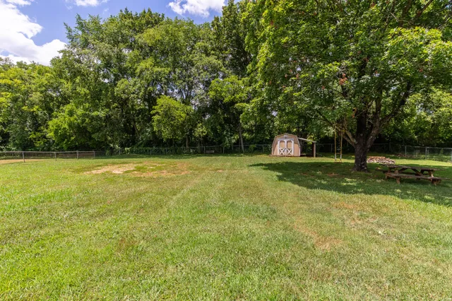 a view of a swimming pool with a bench