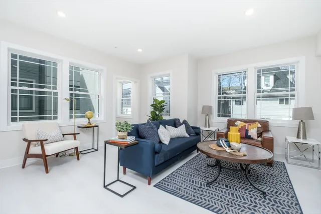 a living room with furniture and a rug