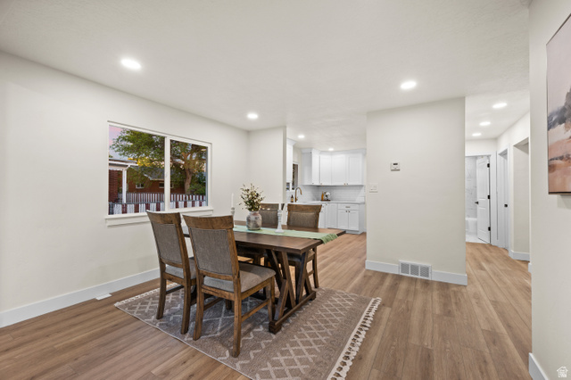 189 West Center Street Midvale, UT 84047 - Photo 12 of 64 Open-concept living space featuring wood-finish flooring, recessed lighting, and a neutral color palette