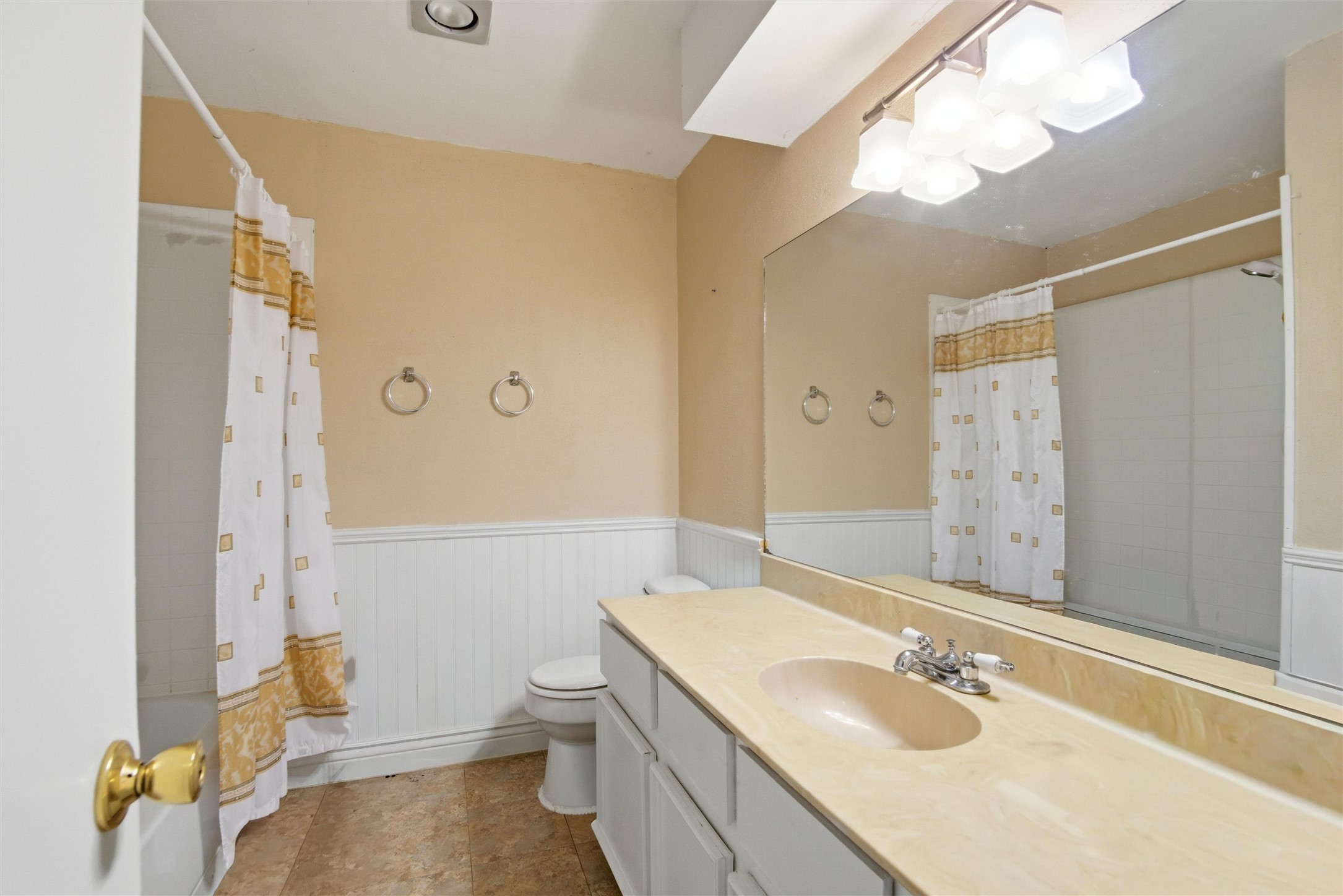 2000 Magazine Street Austin, TX 78727 - Photo 16 of 30 A well-appointed bathroom with functional vanity space and a combined shower-tub.