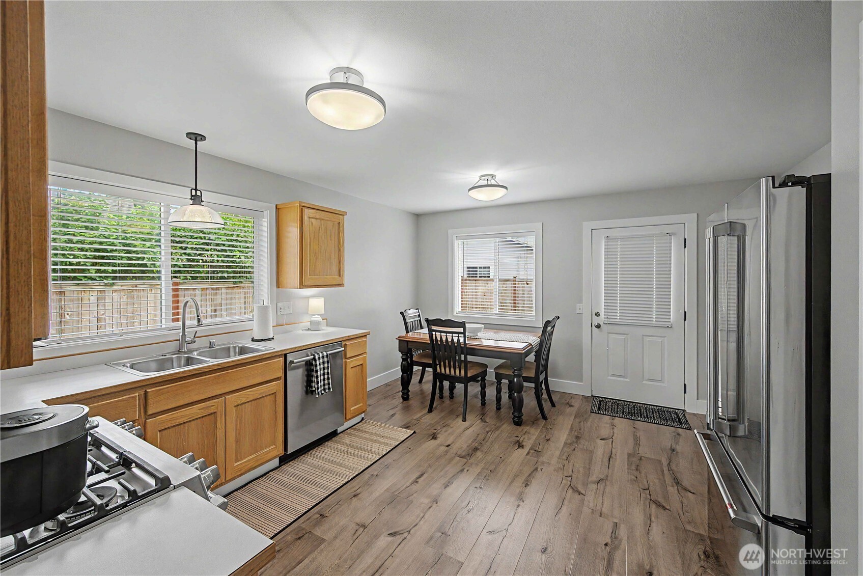 20919 Ronning Road Arlington, WA 98223 - Photo 8 of 28 a kitchen with sink cabinets and wooden floor
