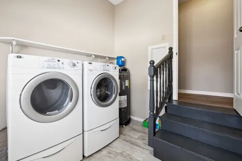 a view of a hallway with washer and dryer