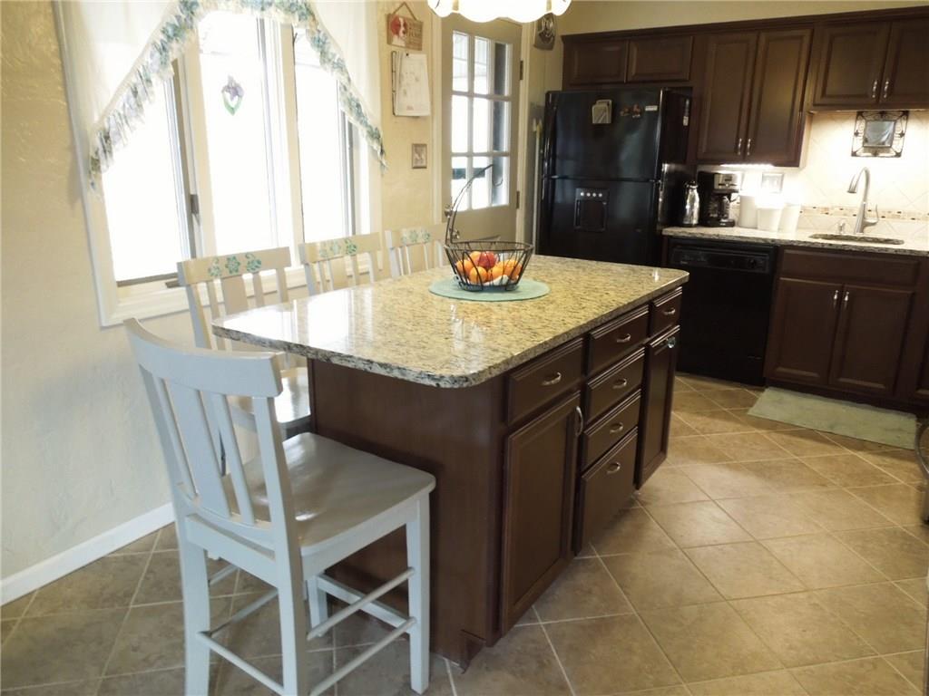 2043 Borland Road Pittsburgh, PA 15243 - Photo 7 of 24 Kitchen island added - additional cabinets and drawers and large granite top with overhang for 4 chairs.