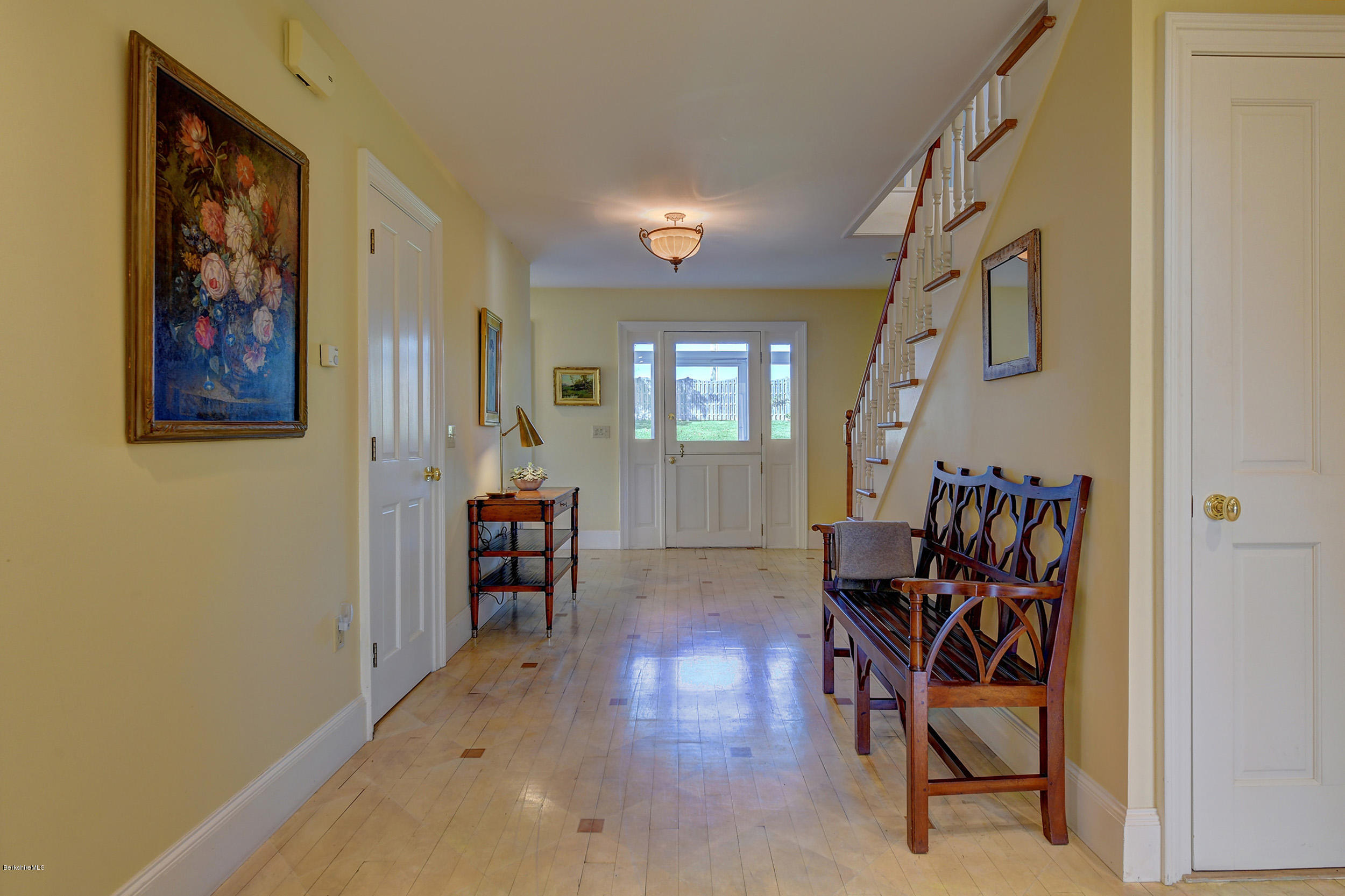 123 State Road Richmond, MA 01201 - Photo 3 of 32 a view of a hallway with wooden floor and dining room