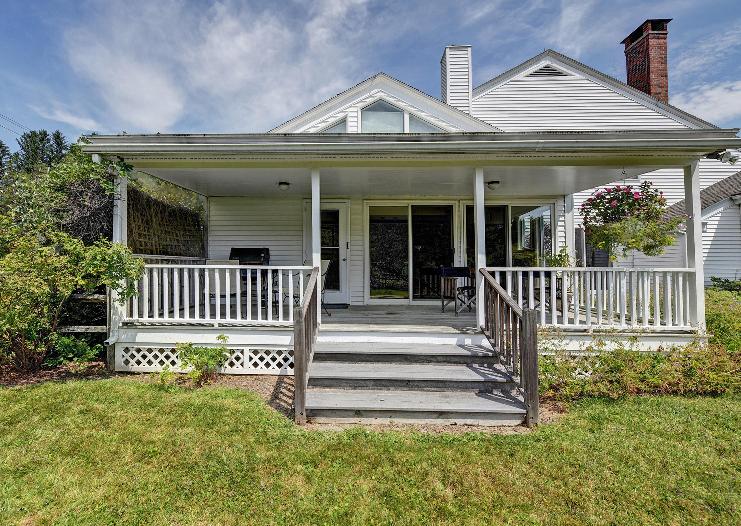123 State Road Richmond, MA 01201 - Photo 28 of 32 a view of a house with a small yard and wooden fence