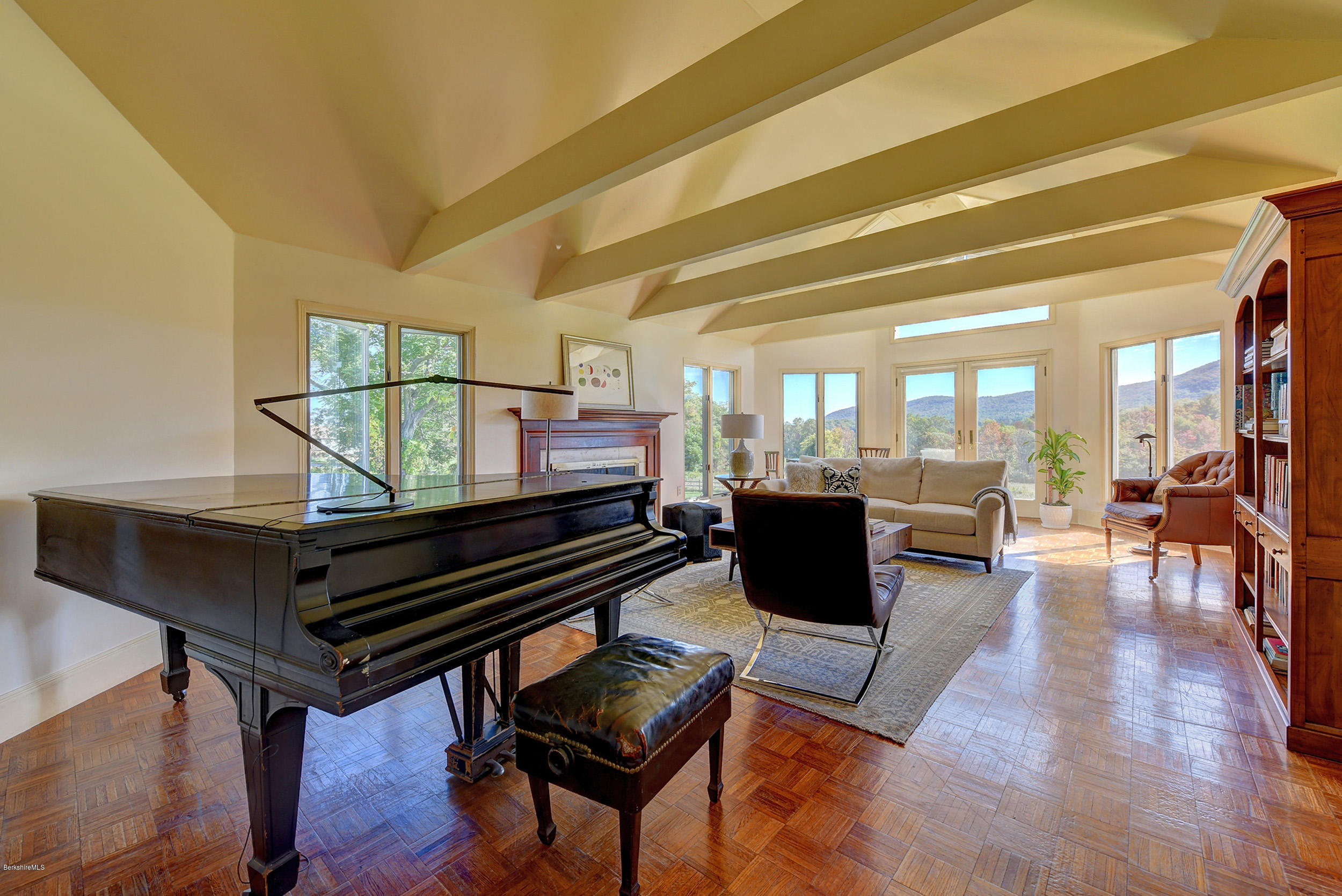 123 State Road Richmond, MA 01201 - Photo 7 of 32 a living room with furniture a wooden floor and a piano