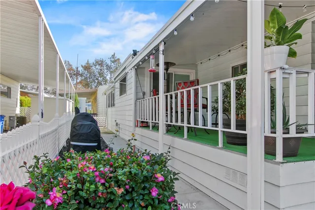 a view of a house with a flower garden