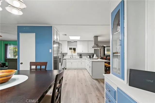 a kitchen with a table and chairs
