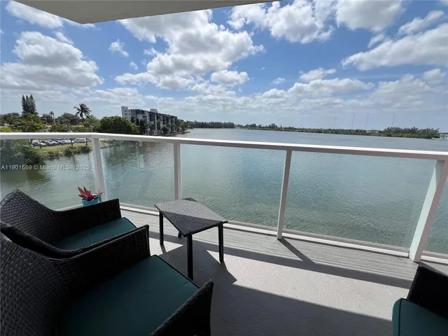 a terrace view with sitting space and lake view