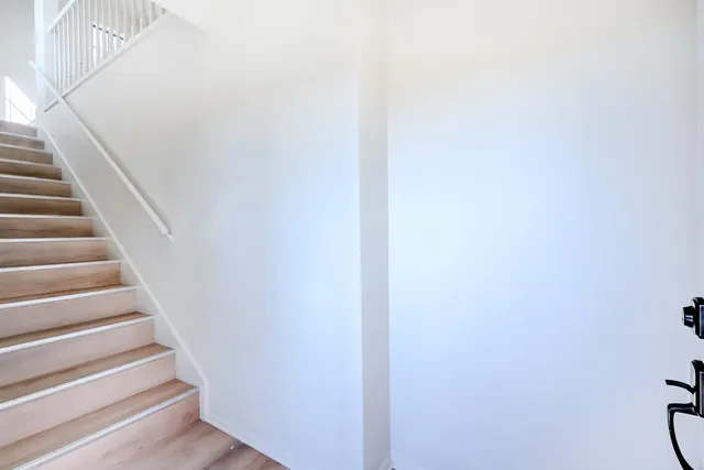 a view of staircase with white walls