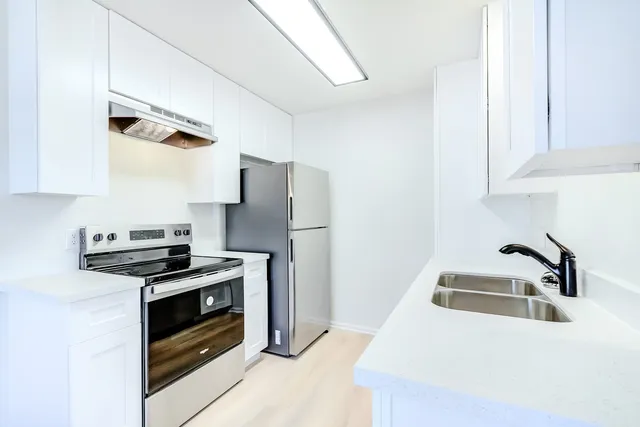 a room with a stove and a lamp