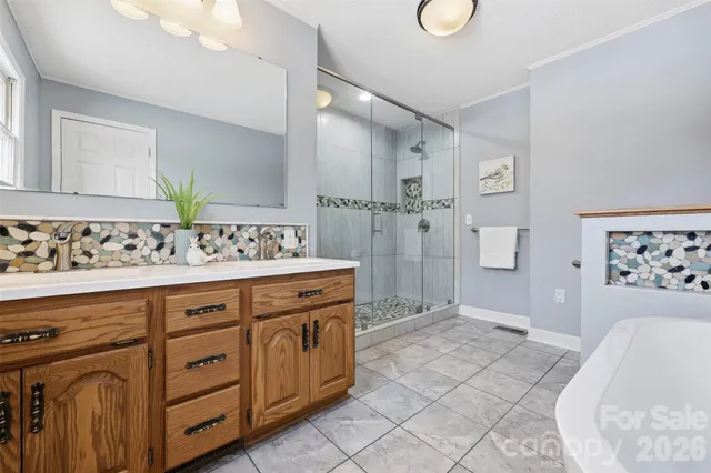 a spacious bathroom with a sink a mirror and a bathtub