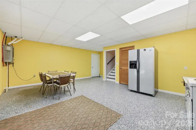 a view of a dining room with furniture and a table