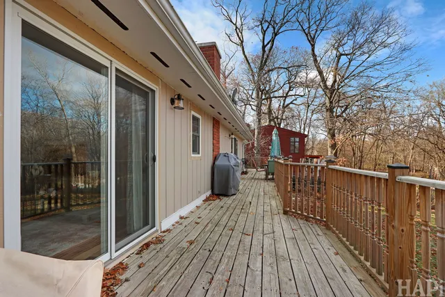 a view of balcony with wooden floor