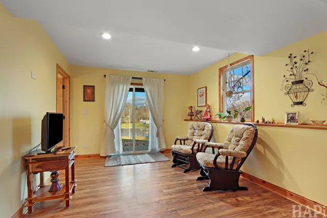 a living room with furniture window and wooden floor