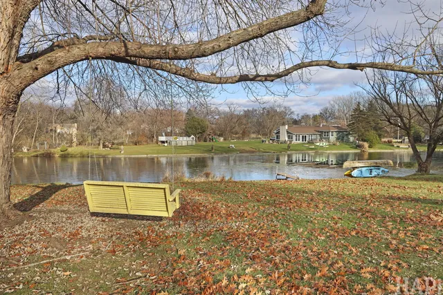 a view of a lake with a large trees