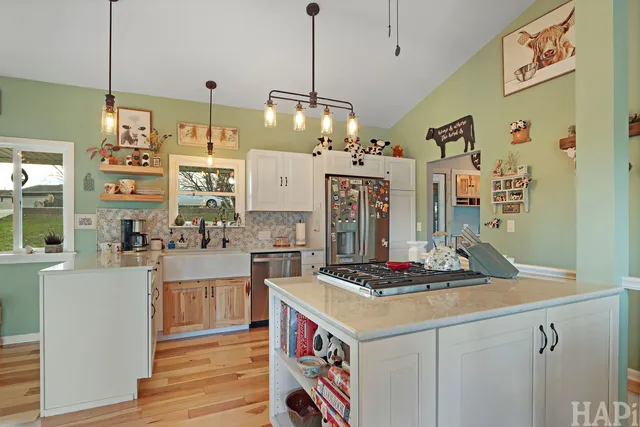 a kitchen with stainless steel appliances granite countertop a stove and a sink