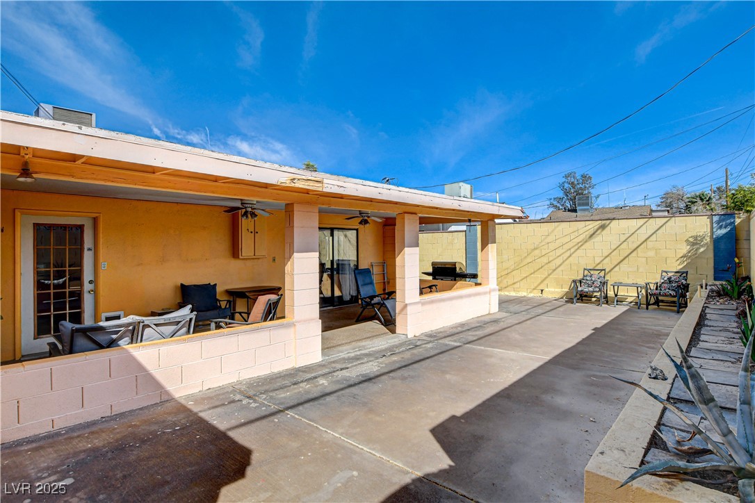 239 West Basic Road Henderson, NV 89015 - Photo 34 of 43 Rear view of house with a patio, stucco siding, fence, and a ceiling fan