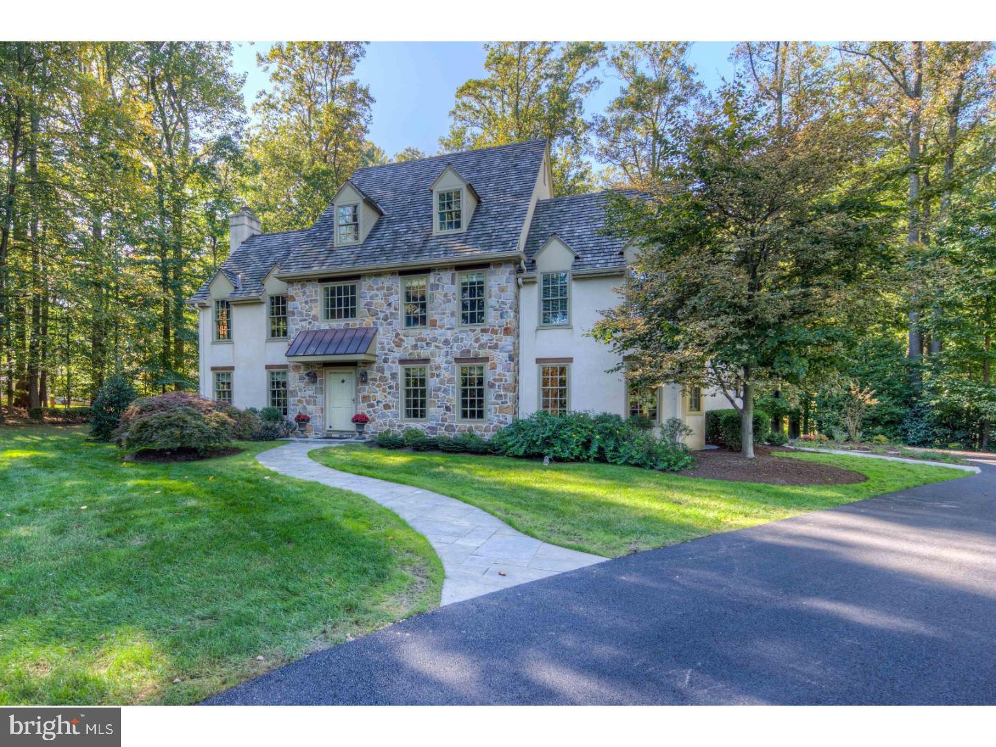 2 Dewitt Lane Wayne, PA 19087 - Photo 1 of 25 a view of a big house with a big yard and large trees