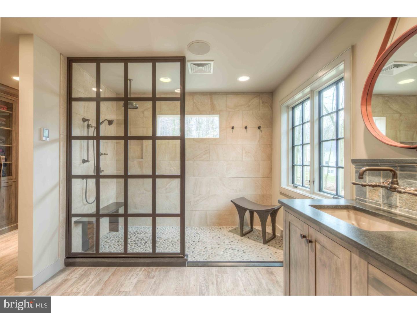 2 Dewitt Lane Wayne, PA 19087 - Photo 12 of 25 a bathroom with a sink a mirror and a window