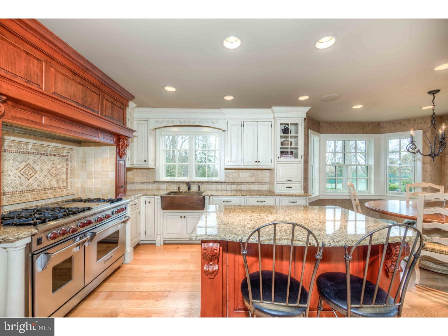 2 Dewitt Lane Wayne, PA 19087 - Photo 3 of 25 a kitchen with stainless steel appliances granite countertop a stove and a kitchen island