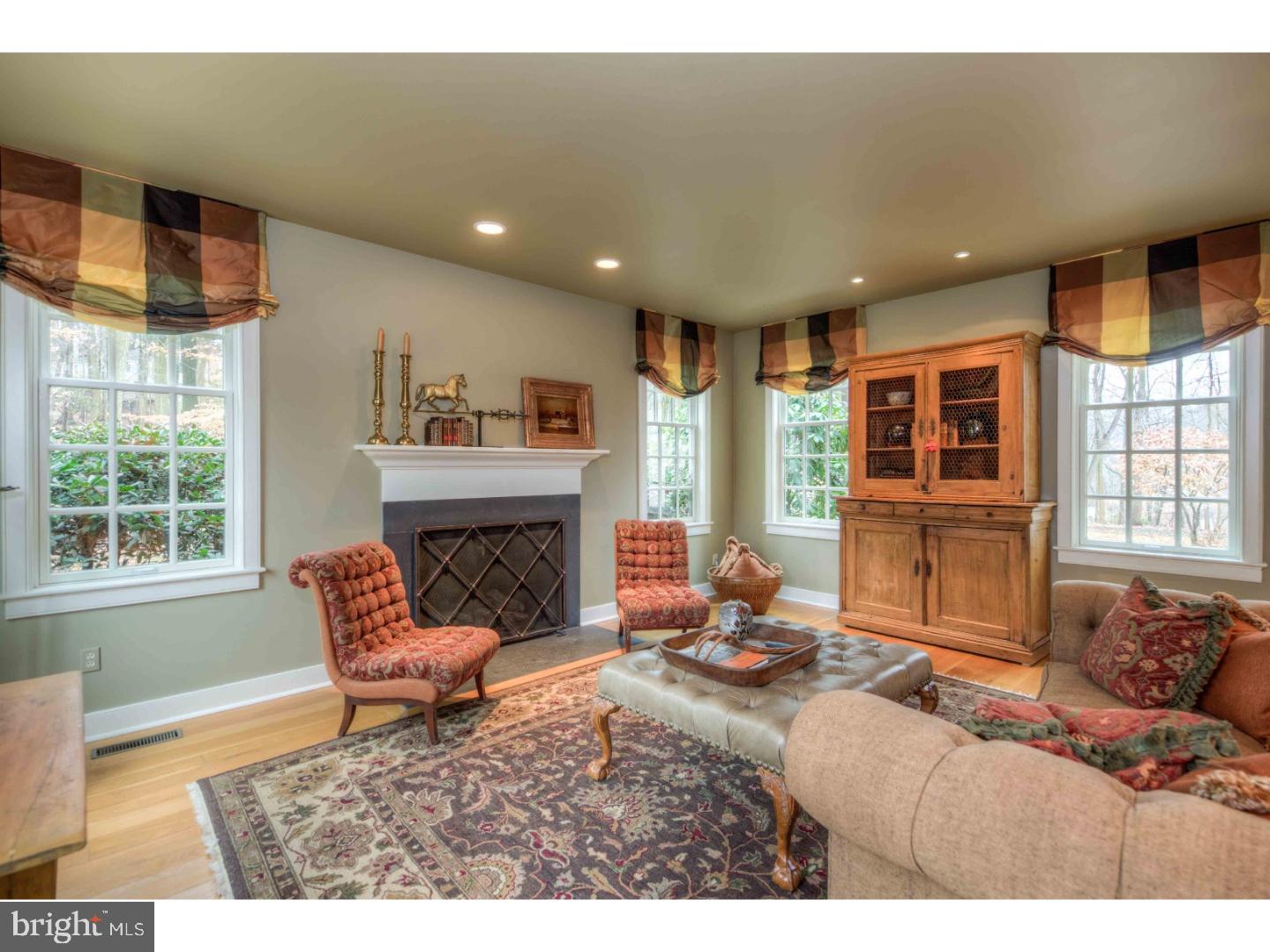 2 Dewitt Lane Wayne, PA 19087 - Photo 9 of 25 a living room with furniture and a fireplace