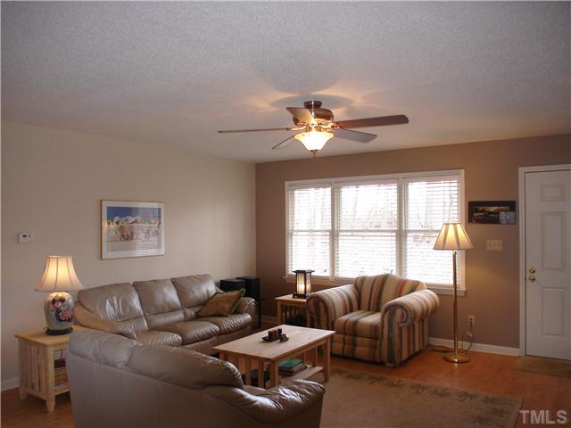 6921 Russell Road Durham, NC 27712 - Photo 4 of 12 a living room with furniture and a window