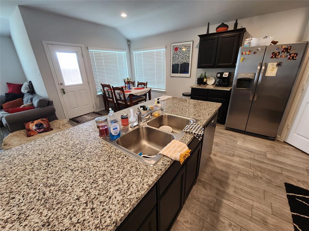 9240 Castorian Drive Fort Worth, TX 76131 - Photo 15 of 40 a living room with furniture and a flat screen tv