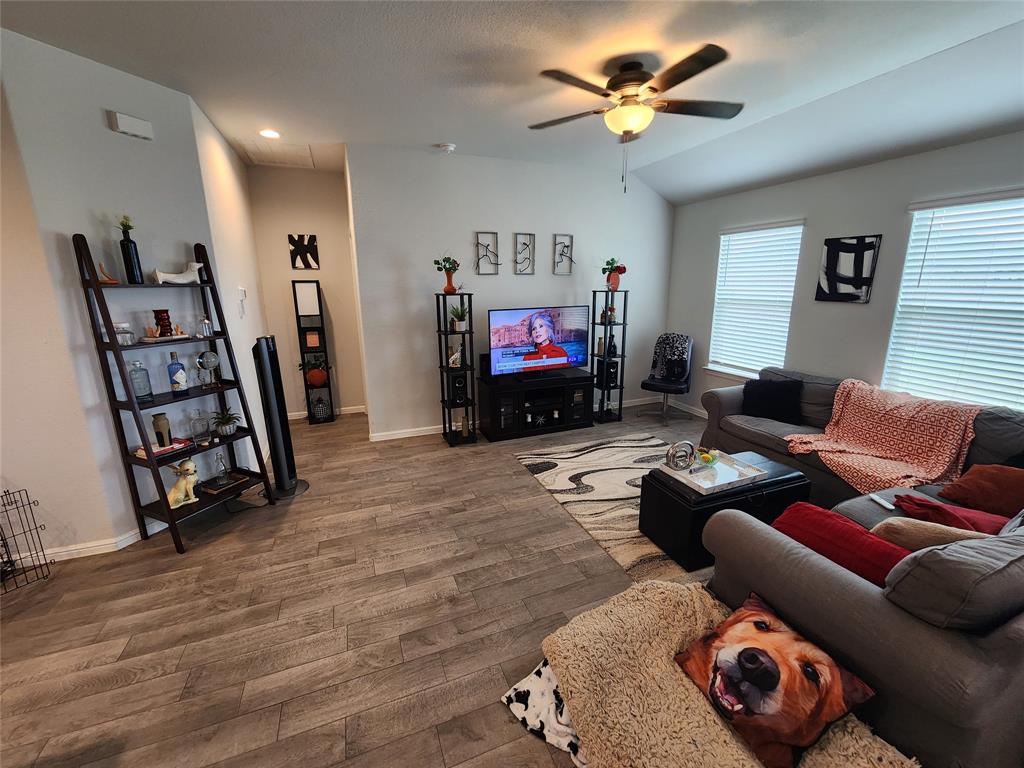 9240 Castorian Drive Fort Worth, TX 76131 - Photo 18 of 40 a living room with furniture and a flat screen tv